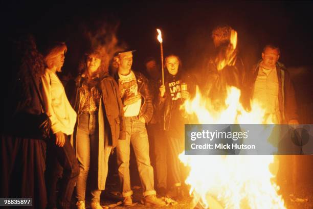 Festival goers behind a camp fire at the Glastonbury Festival in June 1992.