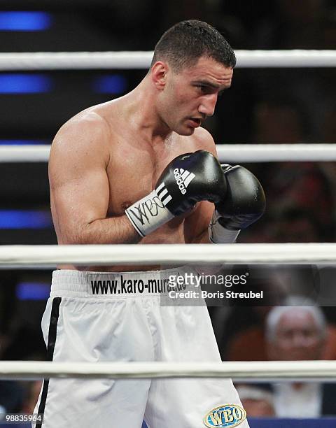 Karo Murat of Germany punches during his WBO Intercontinental Light Heavyweight title fight against Tommy Karpency of the U.S. At the Weser-Ems-Halle...