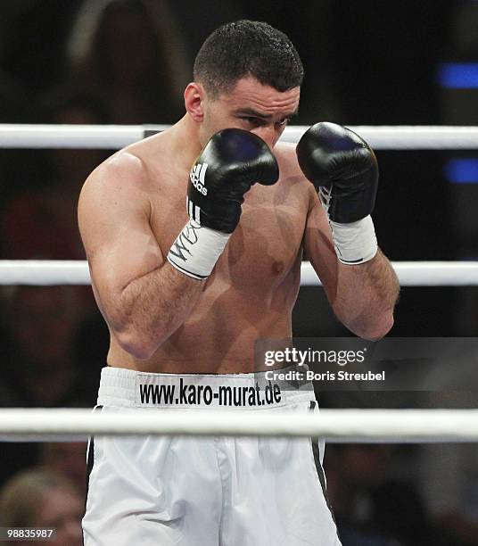 Karo Murat of Germany punches during his WBO Intercontinental Light Heavyweight title fight against Tommy Karpency of the U.S. At the Weser-Ems-Halle...