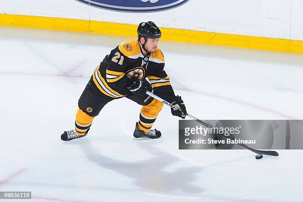 Andrew Ference of the Boston Bruins skates with the puck against the Philadelphia Flyers in Game Two of the Eastern Conference Semifinals during the...