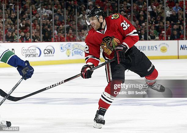 Kris Versteeg of the Chicago Blackhawks tries to put the puck inside at Game One of the Western Conference Semifinals against the Vancouver Canucks...