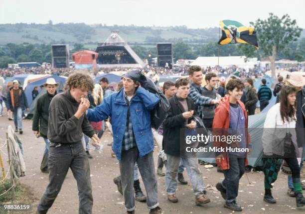 Audience members walking away from the Pyramid stage at the Glastonbury Festival in June 1990.