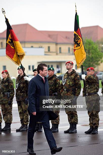German Defence Minister Karl-Theodor zu Guttenberg walks past the guard of honour during the ceremony for returning soldiers of the 13th mechanised...