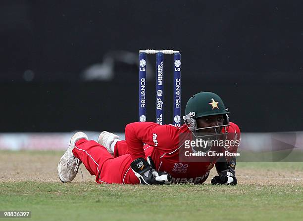 Tatenda Taibu of Zimbabwe looks on as the ball runs for four during the ICC T20 World Cup Group B match between New Zealand and Zimbabwe at the...