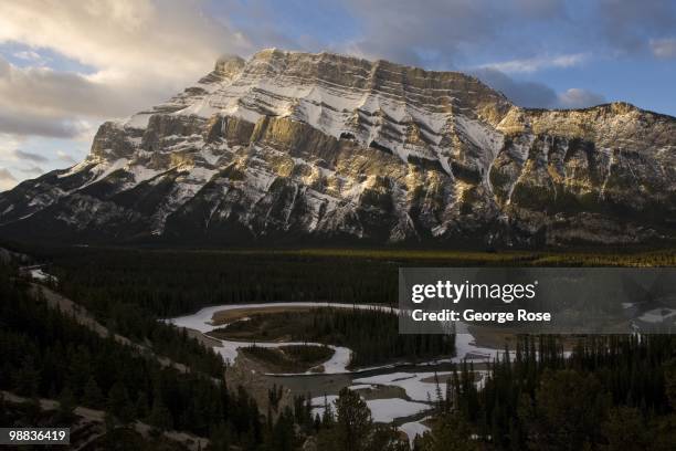 The dramatic snow covered granite face of Mt. Rundle is seen in this 2010 Banff Springs, Canada, early morning landscape photo taken from high above...