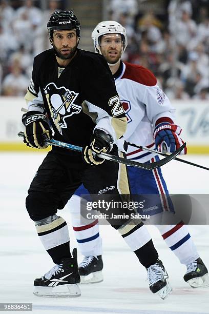 Maxime Talbot of the Pittsburgh Penguins and Dominic Moore of the Montreal Canadiens wait for the puck in Game Two of the Eastern Conference...