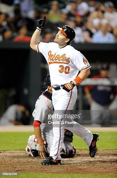 Luke Scott of the Baltimore Orioles celebrates after hitting a home run in the seventh inning against the Boston Red Sox at Camden Yards on May 1,...
