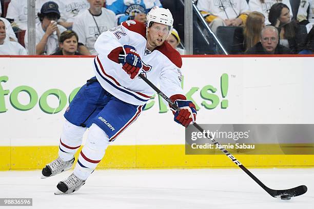 Travis Moen of the Montreal Canadiens skates with the puck against the Pittsburgh Penguins in Game Two of the Eastern Conference Semifinals during...