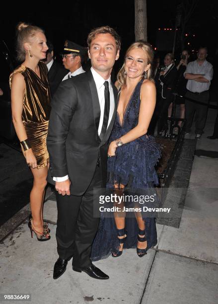 Savannah Miller, Jude Law and Sienna Miller attend the Metropolitan Museum of Art's Costume Institute Gala after party at the Mark Hotel on May 3,...
