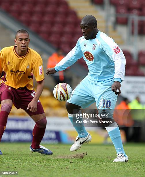 Adebayo Akinfenwa of Northampton Town Controls the ball watched by Steve Williams of Bradford City during the Coca Cola League Two Match between...