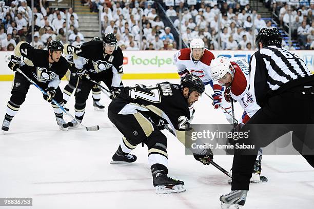 Craig Adams of the Pittsburgh Penguins takes a face off against the Montreal Canadiens in Game Two of the Eastern Conference Semifinals during the...