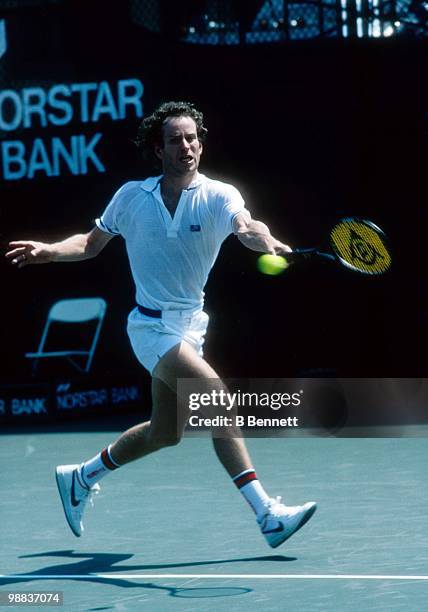 John McEnroe of the United States returns a ball during match play in the Hamlet Challenge Cup circa August 1986 in Long Island, New York.