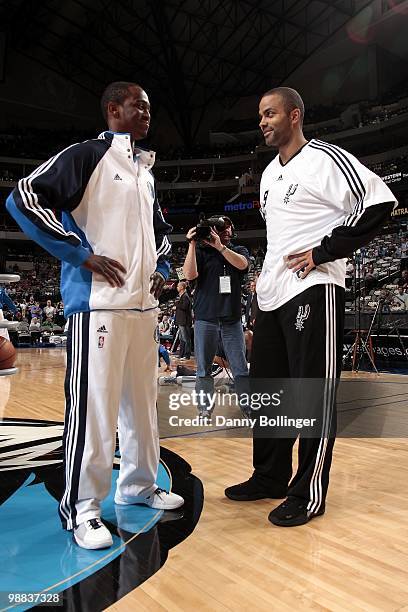 Rodrigue Beaubois of the Dallas Mavericks and Tony Parker of the San Antonio Spurs talk on the court during warm-ups prior to their game at American...