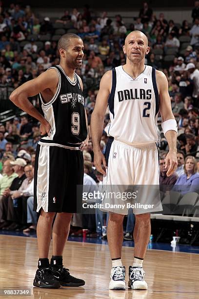 Tony Parker of the San Antonio Spurs and Jason Kidd of the Dallas Mavericks talk on the court during the game at American Airlines Center on April...