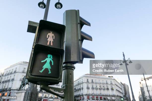 female traffic pedestrian green light in madrid city - ampel stock-fotos und bilder