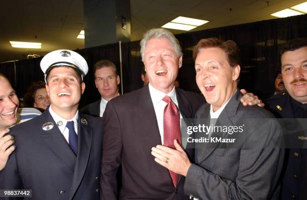 Bill Clinton and Paul McCartney with police officers