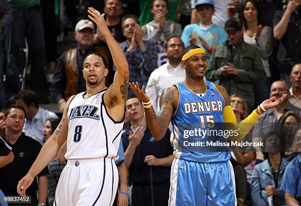 Deron Williams of the Utah Jazz and Carmelo Anthony of Denver Nuggets react after a play in Game Four of the Western Conference Quarterfinals during...