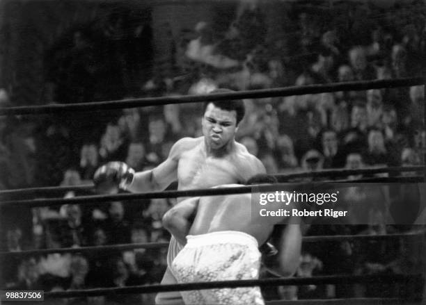 Muhammad Ali throws a left to the head against Joe Frazier during the World Heavyweight Championship at Madison Square Garden on March 8, 1971 in New...