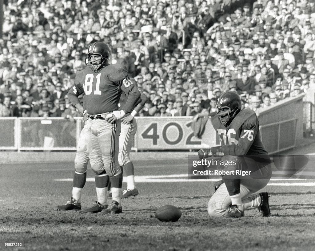 Andy Robustelli and Rosey Grier of the New York Giants look on during ...