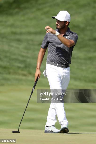 Abraham Ancer of Mexico reacts after a putt on the 18th green during the third round of the Quicken Loans National at TPC Potomac on June 30, 2018 in...