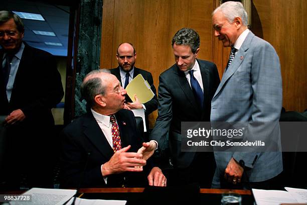 Treasury Secretary Timothy Geithner greets Senate Finance Committee ranking member Sen. Charles Grassley and Sen. Orrin Hatch before testifying to...
