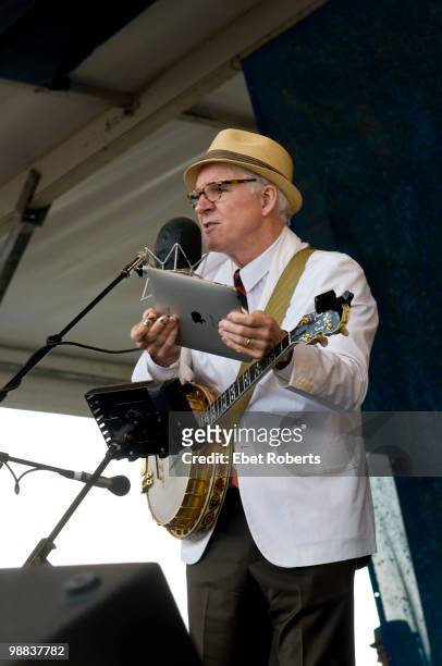 Steve Martin reading the set list off of the newly released ipad at the New Orleans Jazz & Heritage Festival on April 29, 2010 in New Orleans,...