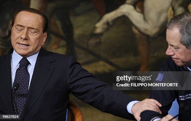 Italian Prime minister Silvio Berlusconi speaks during a joint press conference with the head of the Italian Civil Protection Guido Bertolaso and...