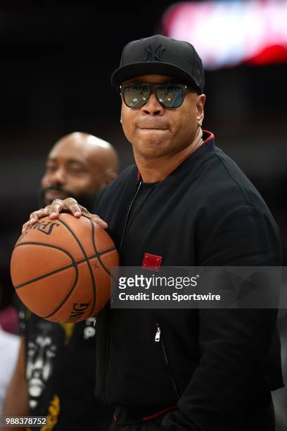 Rapper and entertainer LL Cool J looks on during a game in week two of the BIG3 three on three basketball league on June 29 at the United Center in...