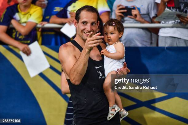 Renaud Lavillenie of France with his daughter during the Pole Vault men of the Meeting of Paris on June 30, 2018 in Paris, France.