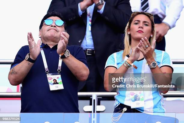 Former Argentina player and manager Diego Maradona looks on with girlfriend Rocio Oliva from the crowd during the 2018 FIFA World Cup Russia Round of...