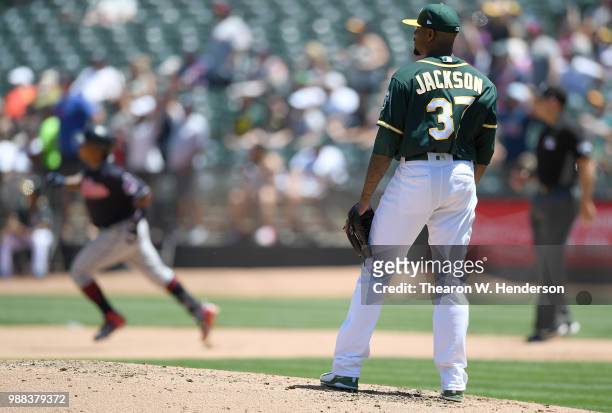 Edwin Jackson of the Oakland Athletics looks on after giving up a solo home run to Jose Ramirez of the Cleveland Indians in the top of the fourth...