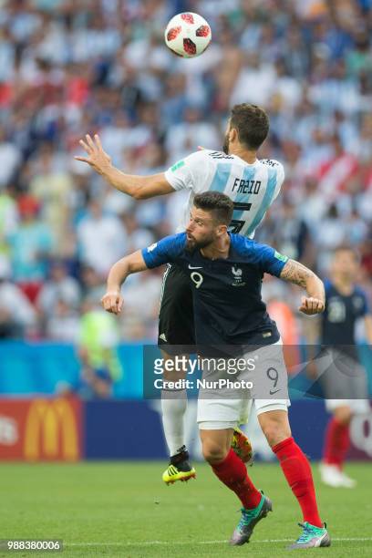 Federico Fazio of Argentina vies Olivier Giroud of France during the 2018 FIFA World Cup Russia Round of 16 match between France and Argentina at...