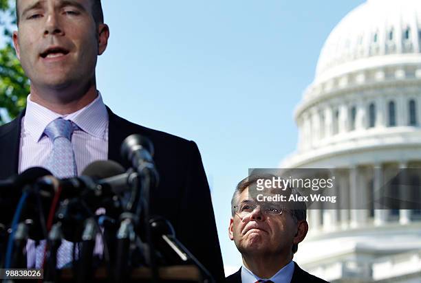 Sen. Robert Menendez listens as Sierra Club Executive Director Michael Brune speaks during a news conference on Capitol Hill May 4, 2010 in...