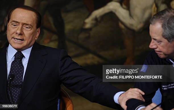 Italian Prime minister Silvio Berlusconi attends a joint press conference with the head of the Italian Civil Protection Guido Bertolaso and General...