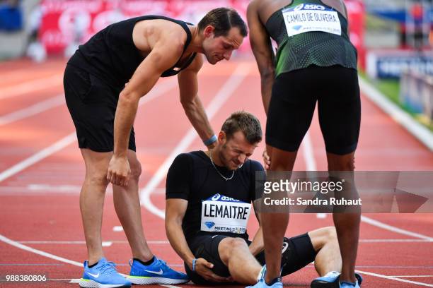 Renaud Lavillenie of France and Christophe Lemaitre of France is injured during the 100m of Meeting of Paris on June 30, 2018 in Paris, France.