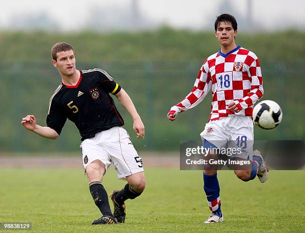 Shkodran Mustafi of Germany and Filip Mihaljevic of Croatia battle for the ball during the U18 international friendly match between Croatia and...