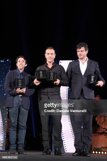 Marcello Fonte, Matteo Garrone and Edoardo Pesce are awarded during the Nastri D'Argento Award Ceremony on June 30, 2018 in Taormina, Italy.