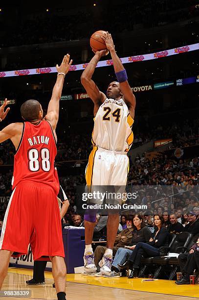 Kobe Bryant of the Los Angeles Lakers makes a jumpshot against Nicolas Batum of the Portland Trail Blazers during the game at Staples Center on April...