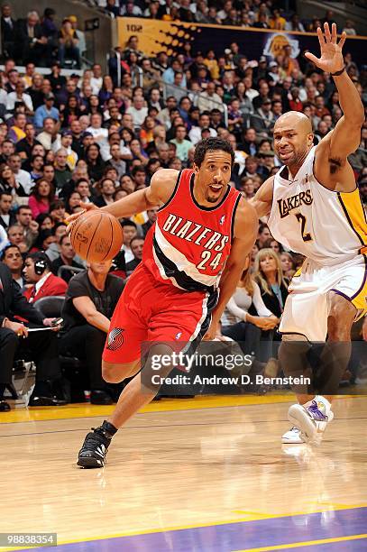 Andre Miller of the Portland Trail Blazers drives the ball to the basket against Derek Fisher of the Los Angeles Lakers during the game at Staples...