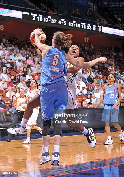 Renee Montgomery of the Connecticut Sun shoots the basketball against Shalee Lehning of the Atlanta Dream during the preseason WNBA game on May 04,...