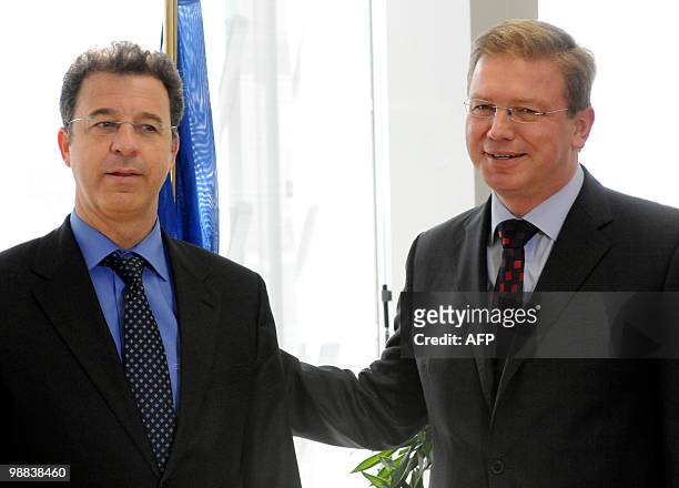 European Union Commissioner for Enlargement and European Neighbourhood Policy Stefan Fule poses with Prosecutor of the International Criminal...
