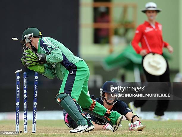 Ireland criclketer Niall O'Brien runs out England cricketer Craig Kieswetter during their match in the ICC World Twenty20 2010 at the Providence...