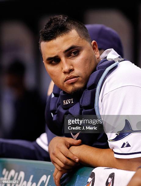 Catcher Dioner Navarro of the Tampa Bay Rays watches his team from the dugout against the Kansas City Royals during the game at Tropicana Field on...