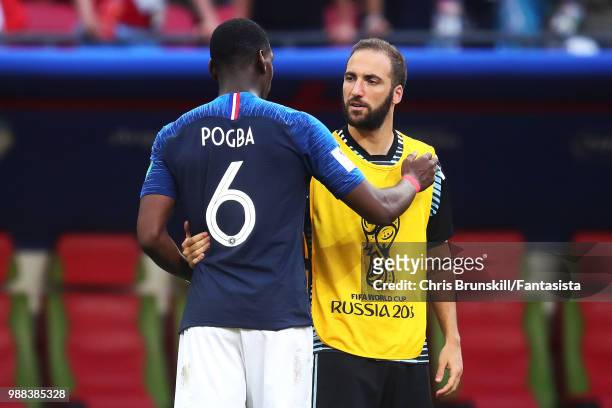 Paul Pogba of France chats with Gonzalo Higuain of Argentina following the 2018 FIFA World Cup Russia Round of 16 match between France and Argentina...