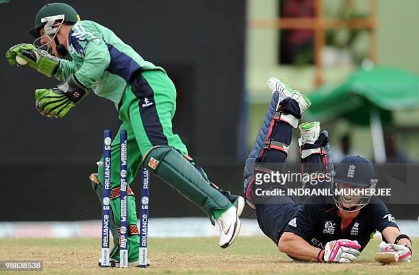 Ireland cricketer Niall O'Brien runs out England cricketer Craig Kieswetter during their match in the ICC World Twenty20 2010 at the Providence...