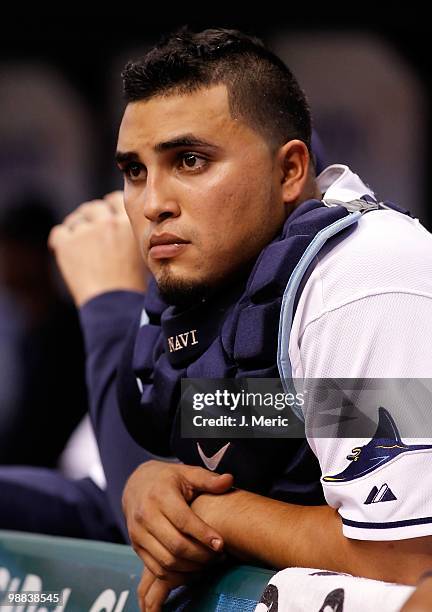 Catcher Dioner Navarro of the Tampa Bay Rays watches his team from the dugout against the Kansas City Royals during the game at Tropicana Field on...