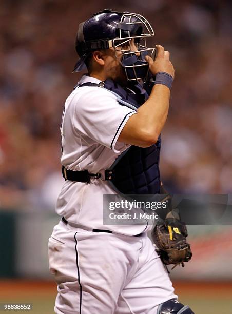 Catcher Dioner Navarro of the Tampa Bay Rays adjusts his mask against the Kansas City Royals during the game at Tropicana Field on May 1, 2010 in St....