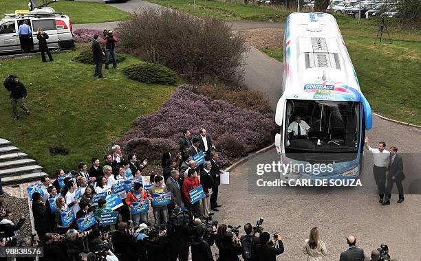 Conservative Party leader David Cameron is greeted by party supporters as he arrives at Linn Products headquarters, East Renfrewshire, on May 4,...