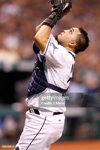 Catcher Dioner Navarro of the Tampa Bay Rays catches a foul ball against the Kansas City Royals during the game at Tropicana Field on May 1, 2010 in...