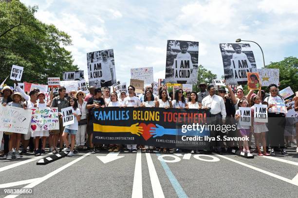 Actor Lin-Manuel Miranda and volunteers march during Families Belong Together Rally In Washington DC Sponsored By MoveOn, National Domestic Workers...